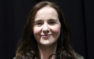 A portrait photograph of Rebecca Farrell