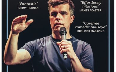 Poster for the comedy show Chris Kent Back At It. It features a photograph of Chris on stage mid-performance, his name and the show title above in large lettering