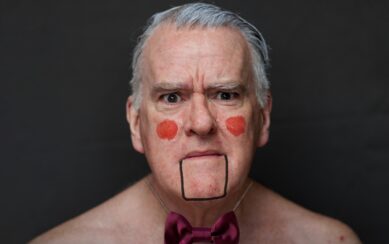 A photograph of Mikel Murfi in stage makeup.