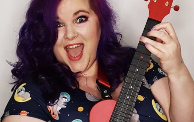 Musician Lisa Cannon posing with a ukulele