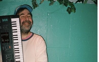comedian holding a keyboard