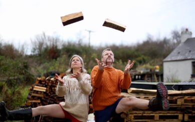Man and woman juggling logs