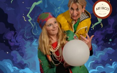 Two women leaning over a crystal ball 
