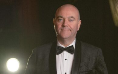 bald man in a tuxedo