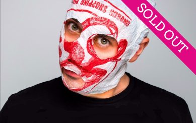 A portrait of Blindboy: he wears his signature bandaged mask and logo tee A portrait of Blindboy: he wears his signature bandaged mask and logo tee