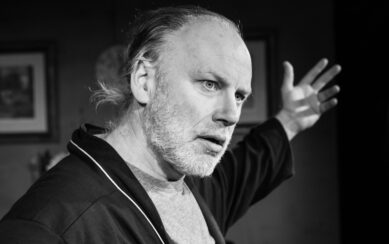 Black and white image of actor performing 