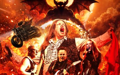 A rock band performs against a background of fire, featuring a winged demon and a flying motorcycle