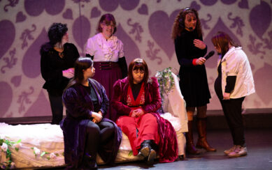 Actors on stage performing Romeo and Juliet 