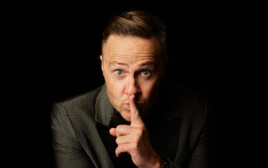 Man putting his finger to his lips