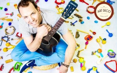 photo of Kyle Riley with a guitar