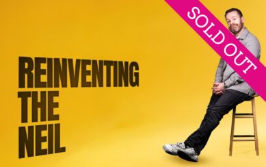 Neil Delamere sitting in a chair