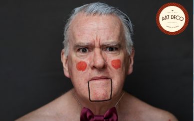 Mikel Murfi looks like a puppet with painted cheeks and a drawn-on jaw.