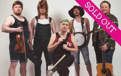 Band members standing with their instruments