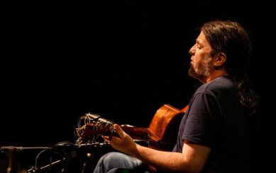 A profile photo of Seamie O'Dowd playing guitar A profile photo of Seamie O'Dowd playing guitar