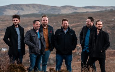 Six men standing in a field