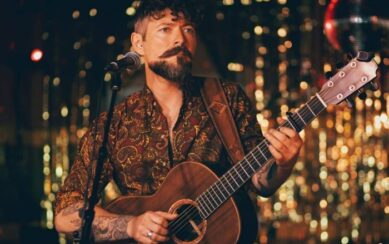 A photograph of Niall McCabe on stage