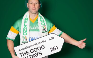 a photo of a performer holding a road sign 