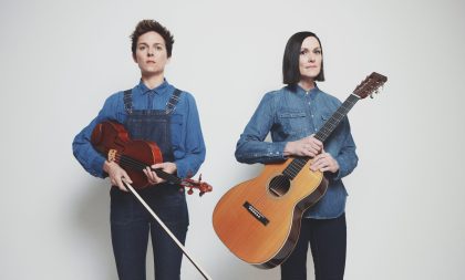 Beth Meyers and Monica Mugan posing with their instruments Beth Meyers and Monica Mugan posing with their instruments
