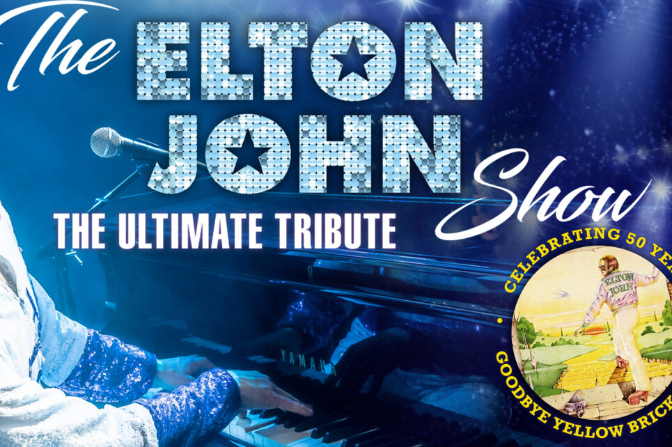 The poster for "The Elton John Tribute Show", depicting the artist as he's singing at a piano, wearing a white shirt and white sunglasses.