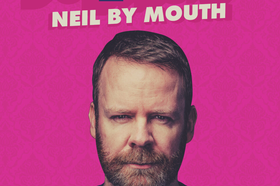 A poster for Neil Delamere's show Neil by Mouth featuring a portrait of Neil against a bright pink background