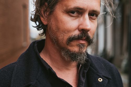 A portrait photograph of John Paul White.