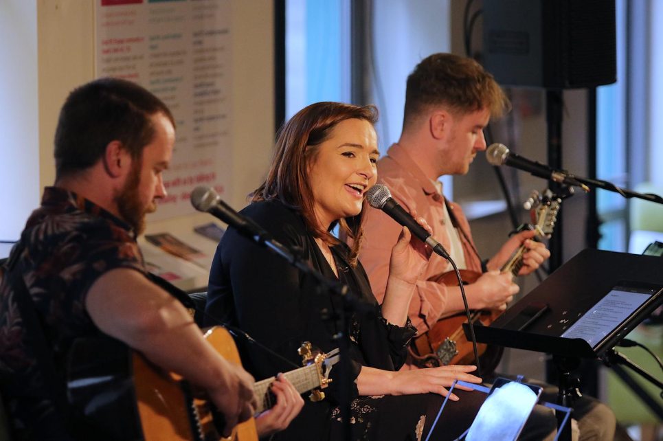 Dave Flynn, Sinead Conway, and Luke Devaney performing in the Hawk's Well Foyer