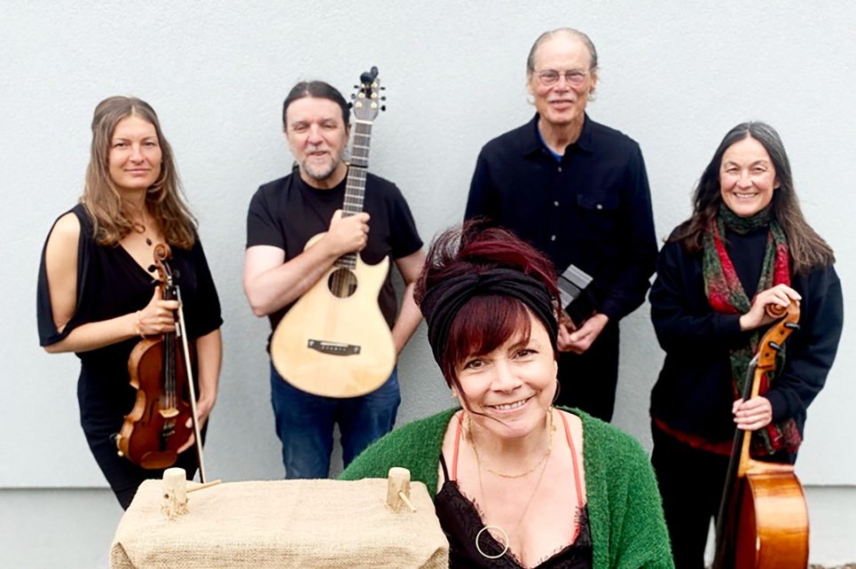 A photo of musicians with their instruments