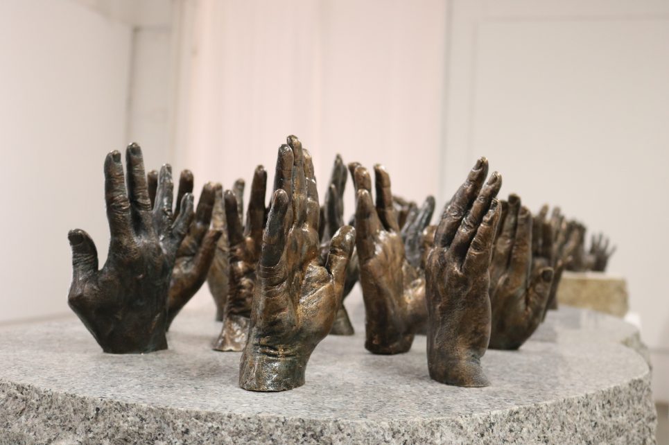 bronze hand-casts, mounted on granite stone