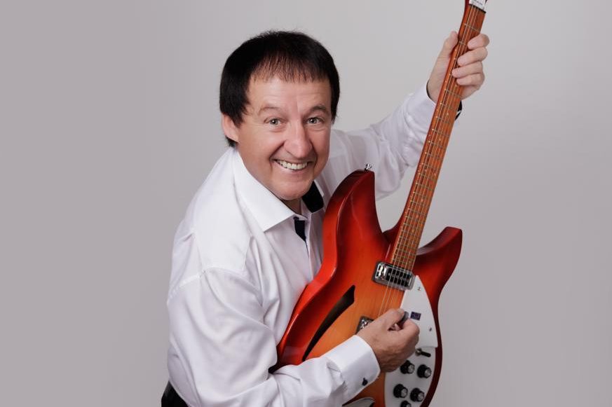 Performer Declan Nerney posing with a guitar 