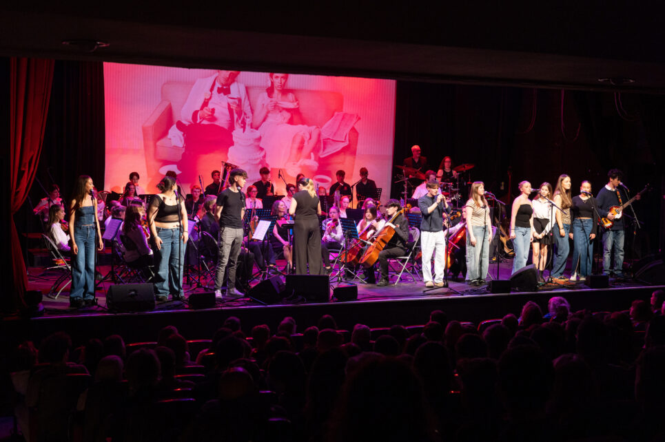 Teenagers performing on stage