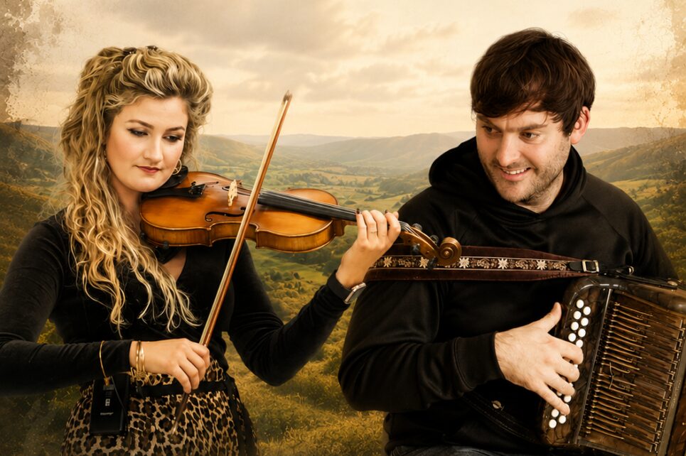 Girl playing violin next to guy playing accordian