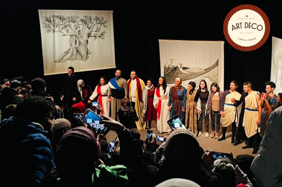 Actors lined up on stage