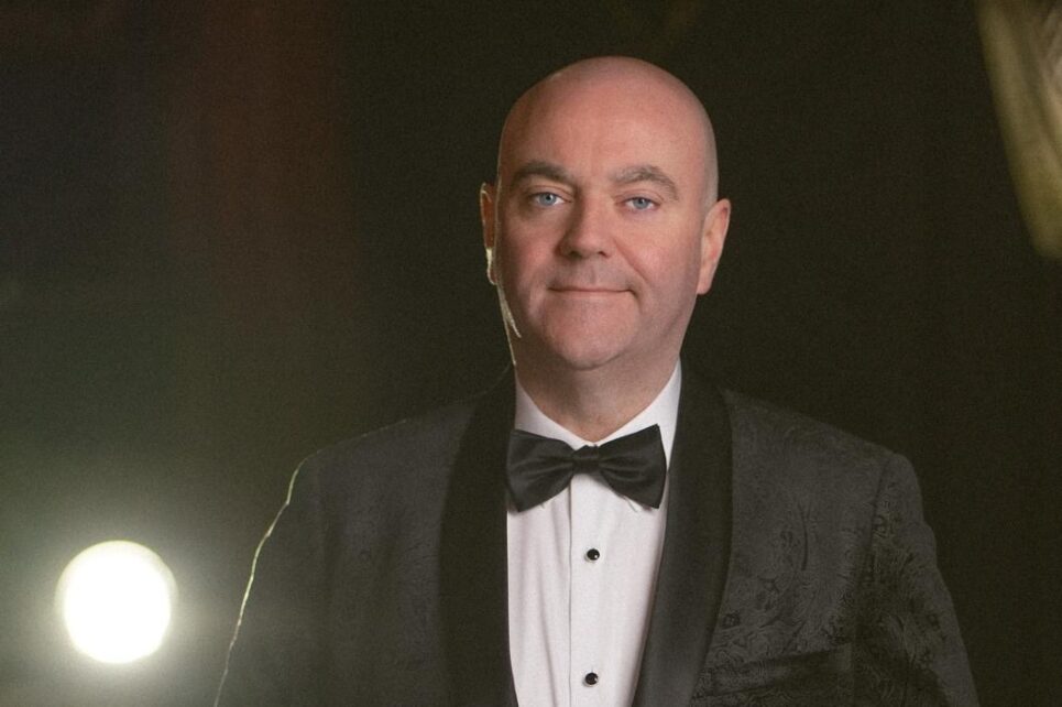 bald man in a tuxedo