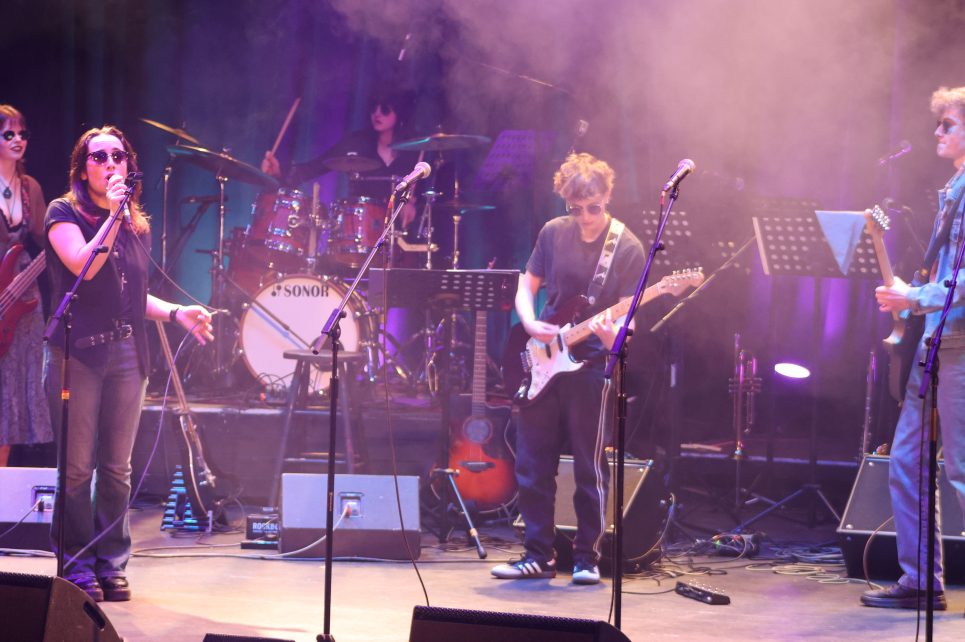 Photograph of young band playing on stage