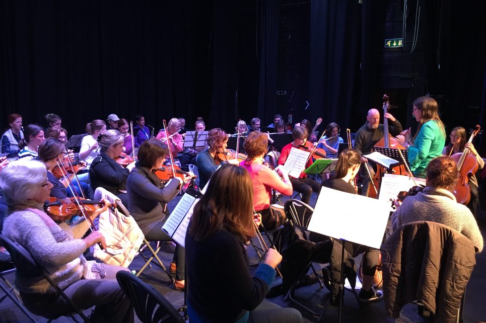 A photograph depicting the Sligo Adult Community Orchestra in rehearsal