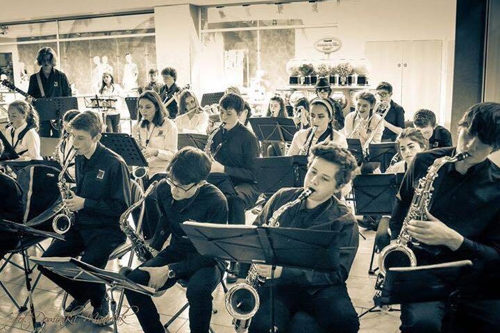 A photograph of young musicians performing