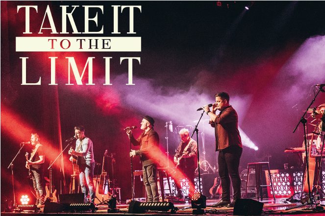 Image of the band on stage as seen from the audience's perspective with the show's title, Take it to the limit in the upper left corner.