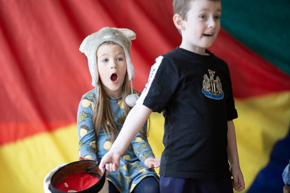 An image of children during a performance An image of children during a performance