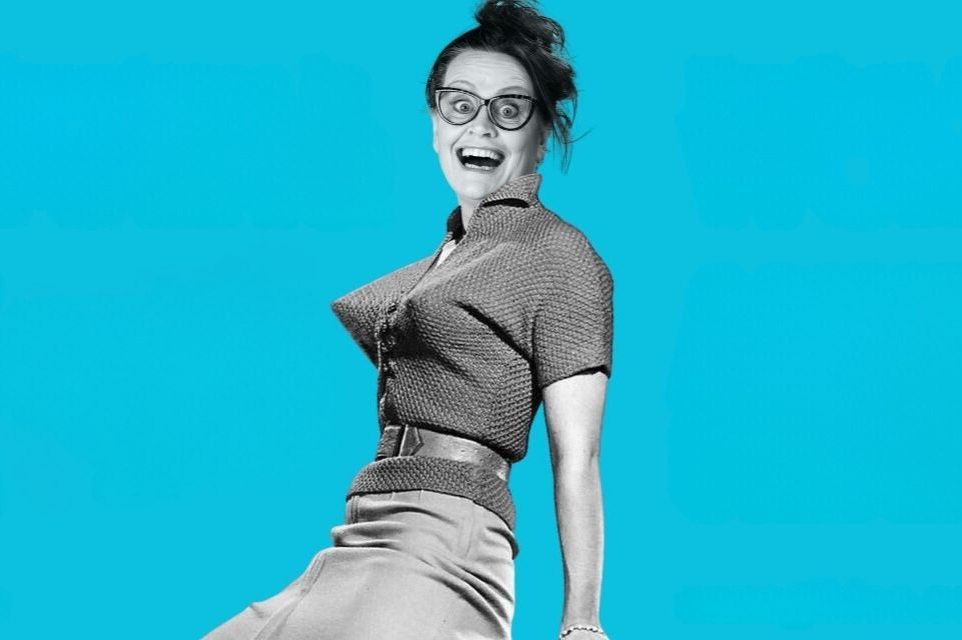 Poster of comedian Anne Gildea wearing a pointy bra against a bright turquoise background