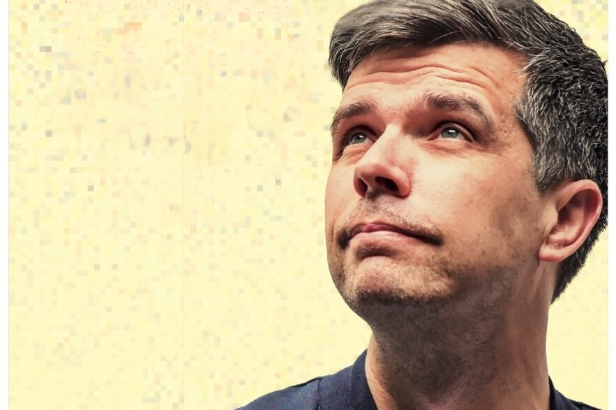 Comedian Chris Kent looking off pensively Comedian Chris Kent looking off pensively