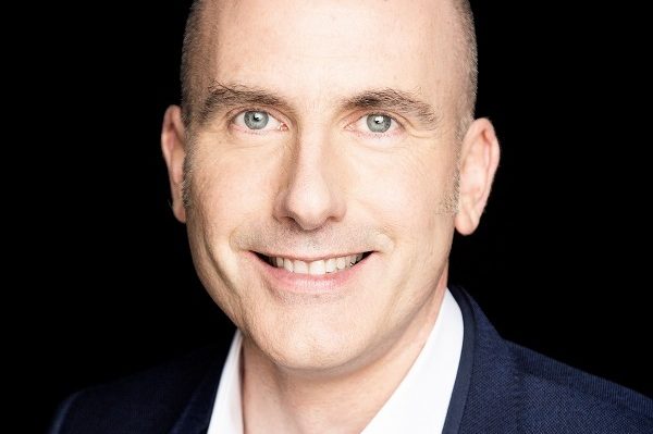 A portrait photograph of Dr David Coleman