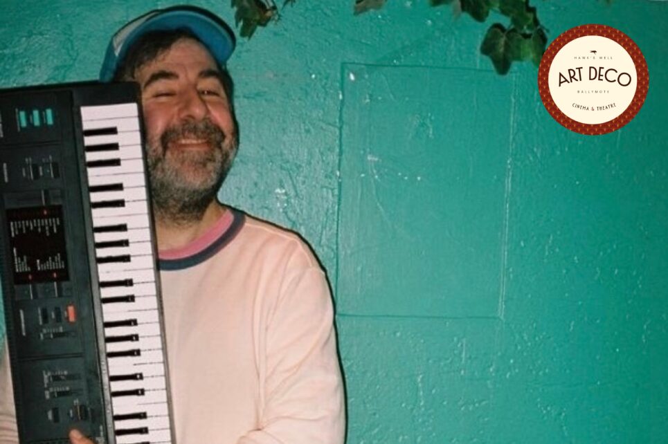 comedian holding a keyboard