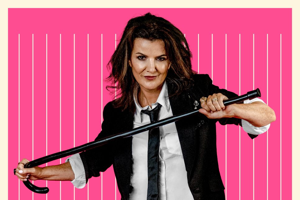 Deirdre O'Kane posing with a cane against a pink background Deirdre O'Kane posing with a cane against a pink background