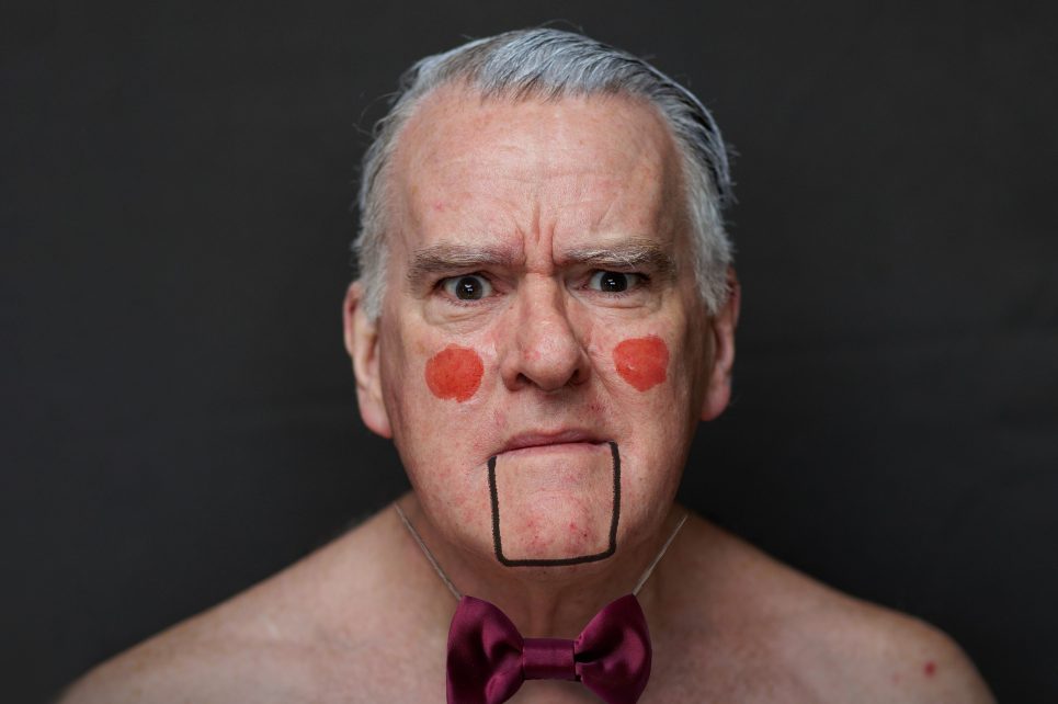 A photograph of Mikel Murfi in stage makeup. A photograph of Mikel Murfi in stage makeup.