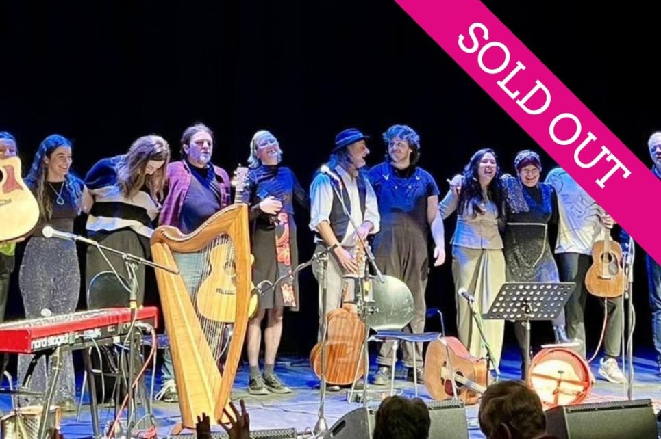 A photograph of the Folk Families performers on stage A photograph of the Folk Families performers on stage