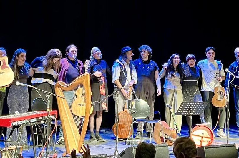 A photograph of the Folk Families performers on stage A photograph of the Folk Families performers on stage