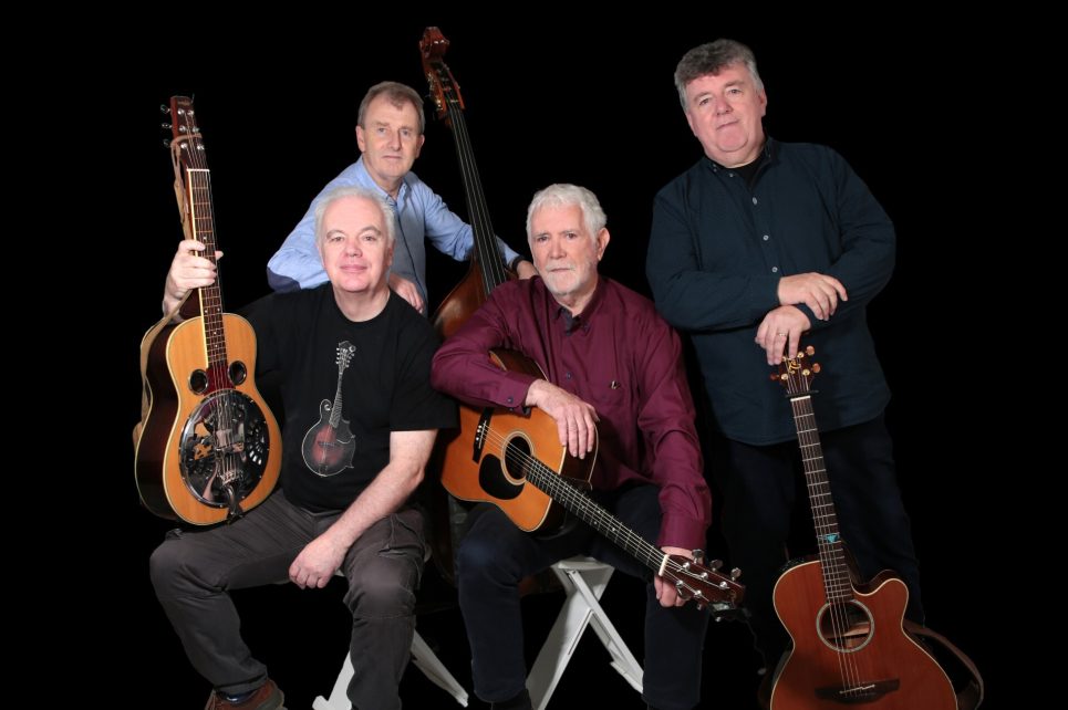 A portrait photograph of the band Jargon against a black background A portrait photograph of the band Jargon against a black background