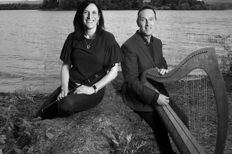 Musicians by river, one holding harp. Musicians by river, one holding harp.