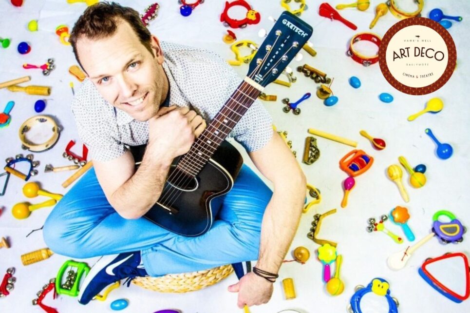 photo of Kyle Riley with a guitar
