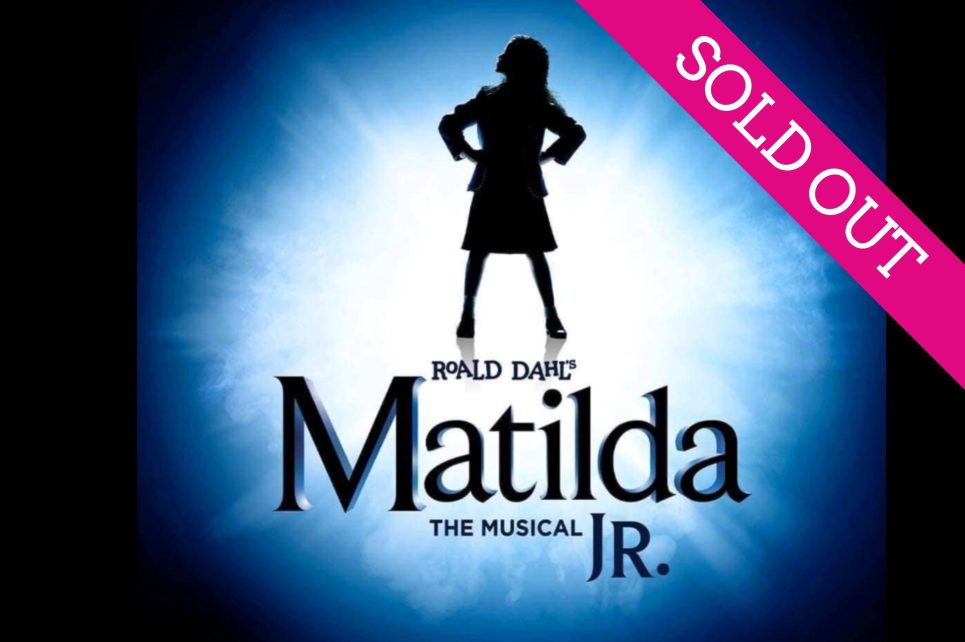 A silhouette of a girl at the centre of a blue burst